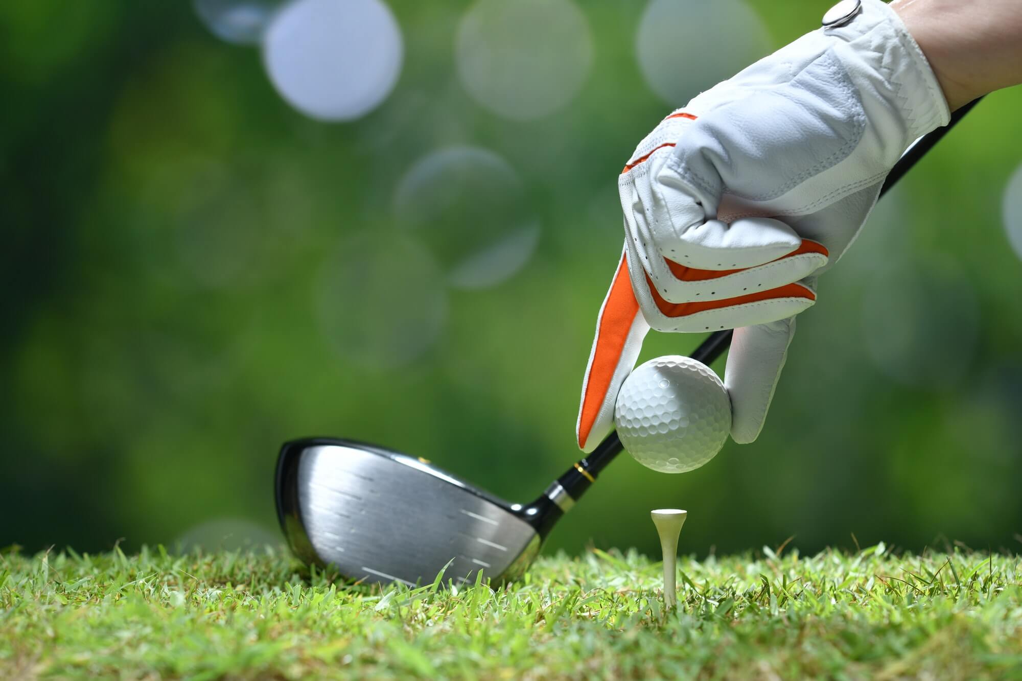 Golf ball on a tee at a charity outing