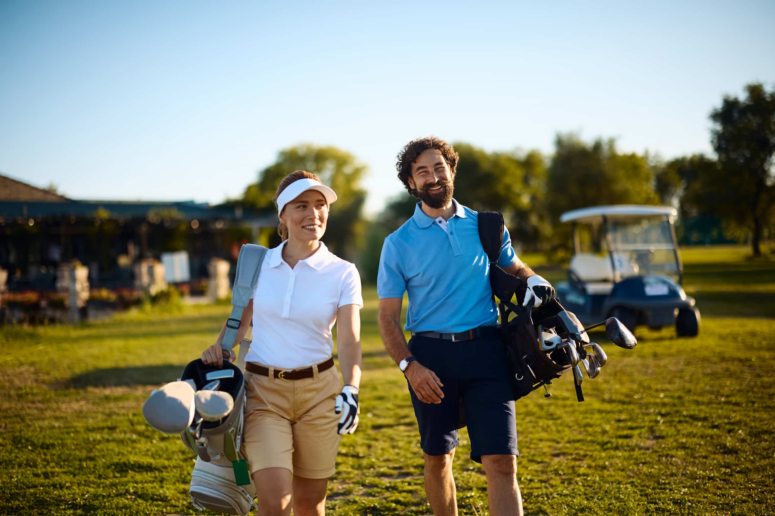 Two golfers walking the course at a charity outing